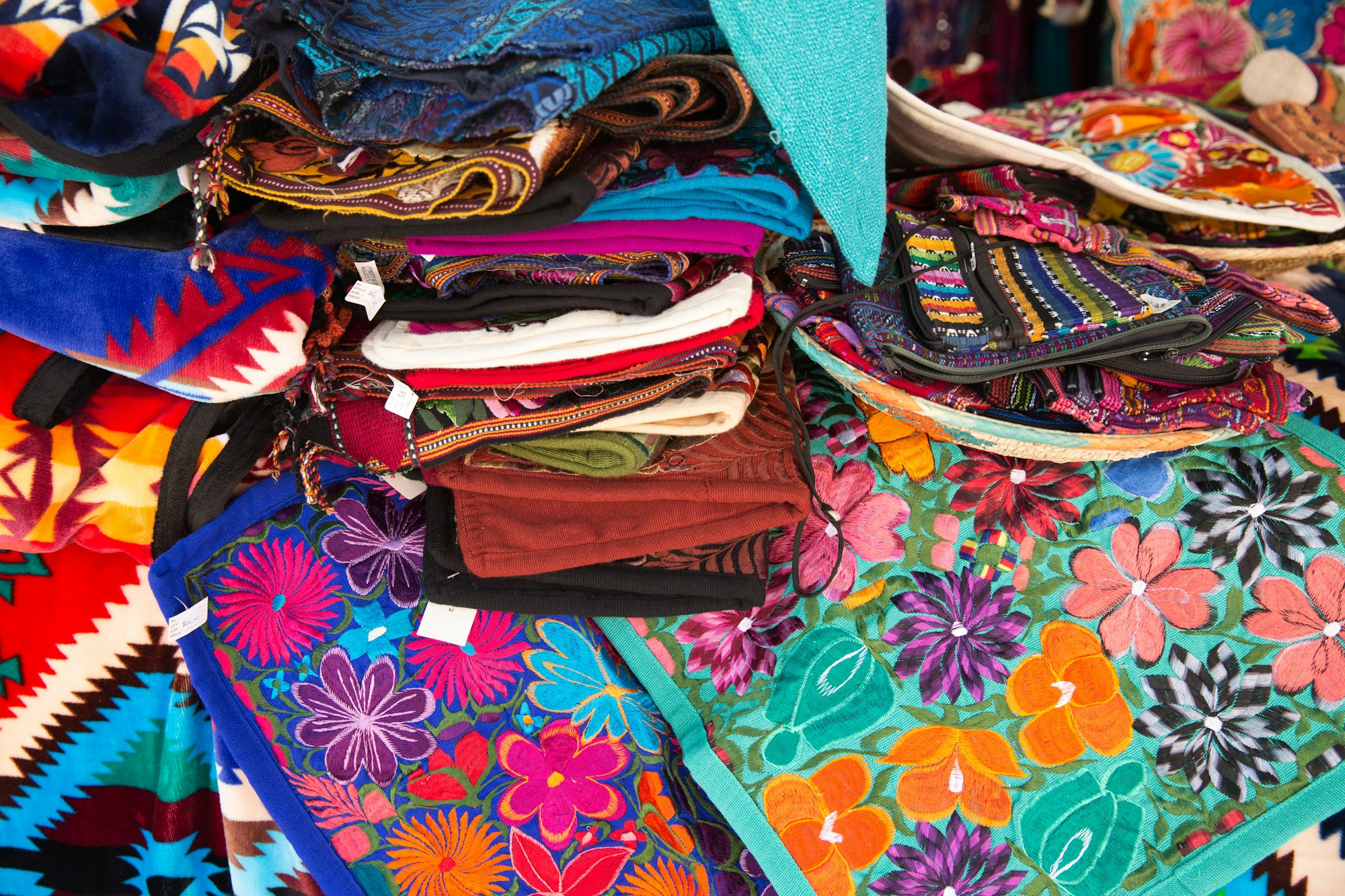 Colorful hand embroidered pillow covers at a market in Santa Fe, NM